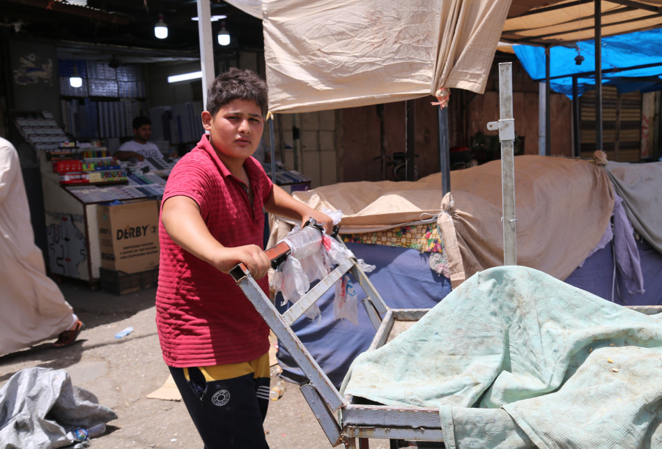 My Name is Azooz Izzedine & I am 15. Every day I come at 8 am to Salaheddin Street (Khan Khurma, Dates Sarai) carrying stuff from a place to another by the carrier making 6,000 IQD ($4) a day.